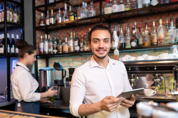 Young Cheerful Waiter Touchpad Standing Front Camera While Looking Online — Stock Photo, Image