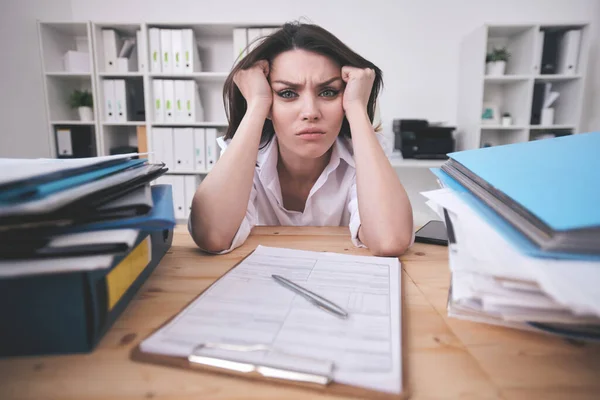 Portrait Frowning Young Businesswoman Confused Paperwork Sitting Head Hands Office — Stock Photo, Image