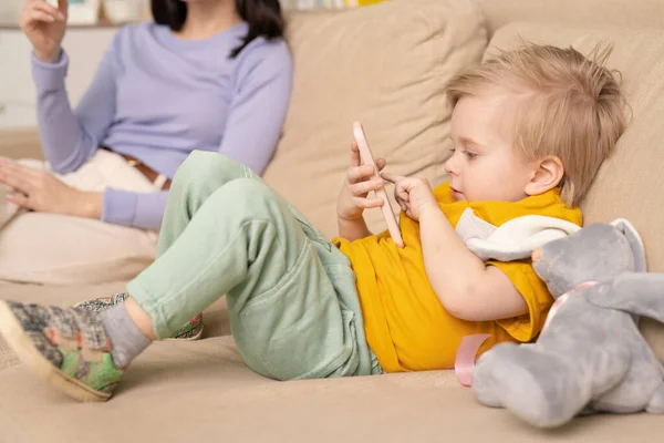 Close Little Boy Blond Hair Lying Sofa Playing Smartphone Game — Stock Photo, Image