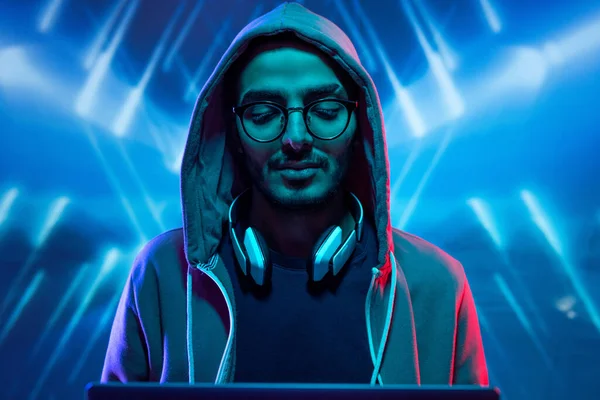 Young Hacker Hoody Sweatshirt Glasses Breaking Computer System Blue Illuminated — Stock Photo, Image
