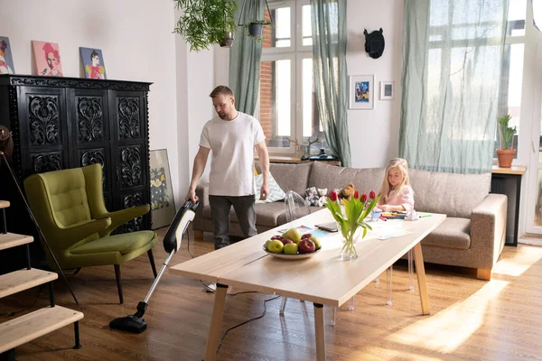 Young Man Casualwear Using Vacuum Cleaner While Doing Domestic Chores — Stock Photo, Image