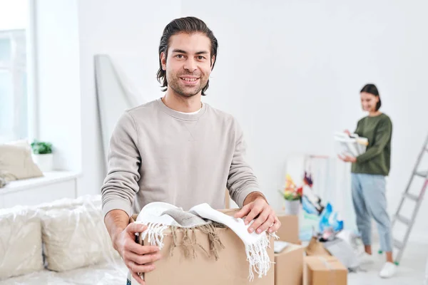 Happy Young Man Light Grey Sweatshirt Holding Box Scarves Plaids — Stock Photo, Image