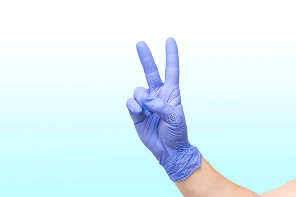 Male hand on white blue gradient background showing the symbol of victory or the number two — Stock Photo, Image