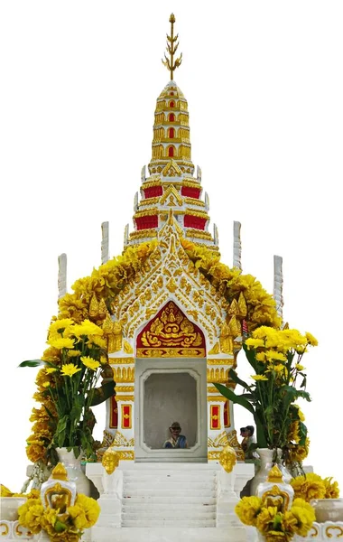 the mini doll inside thai spirit house or joss house isolated on white background.