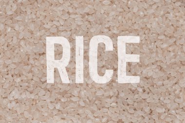 Yakın plan pirinç taneleri. Çiğ yulaf lapası manzarası. Tahıl deseni. Vegan Çiğ Gıda.