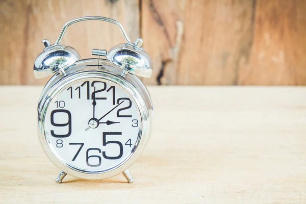 Clock on wood background