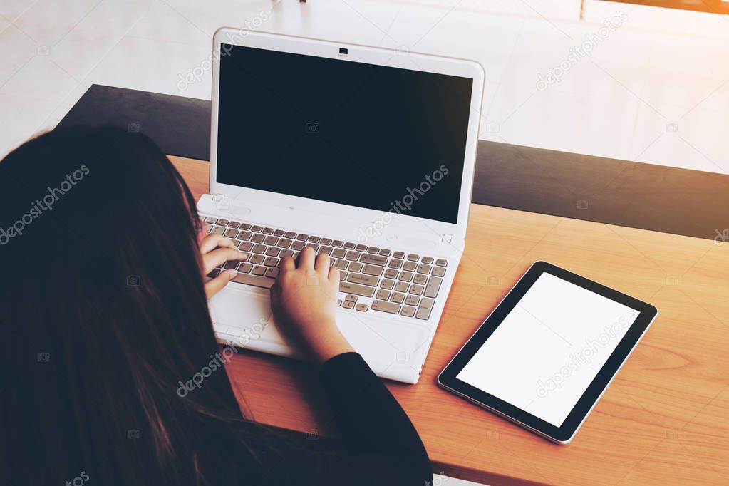 Teenage freelance working business on laptop.