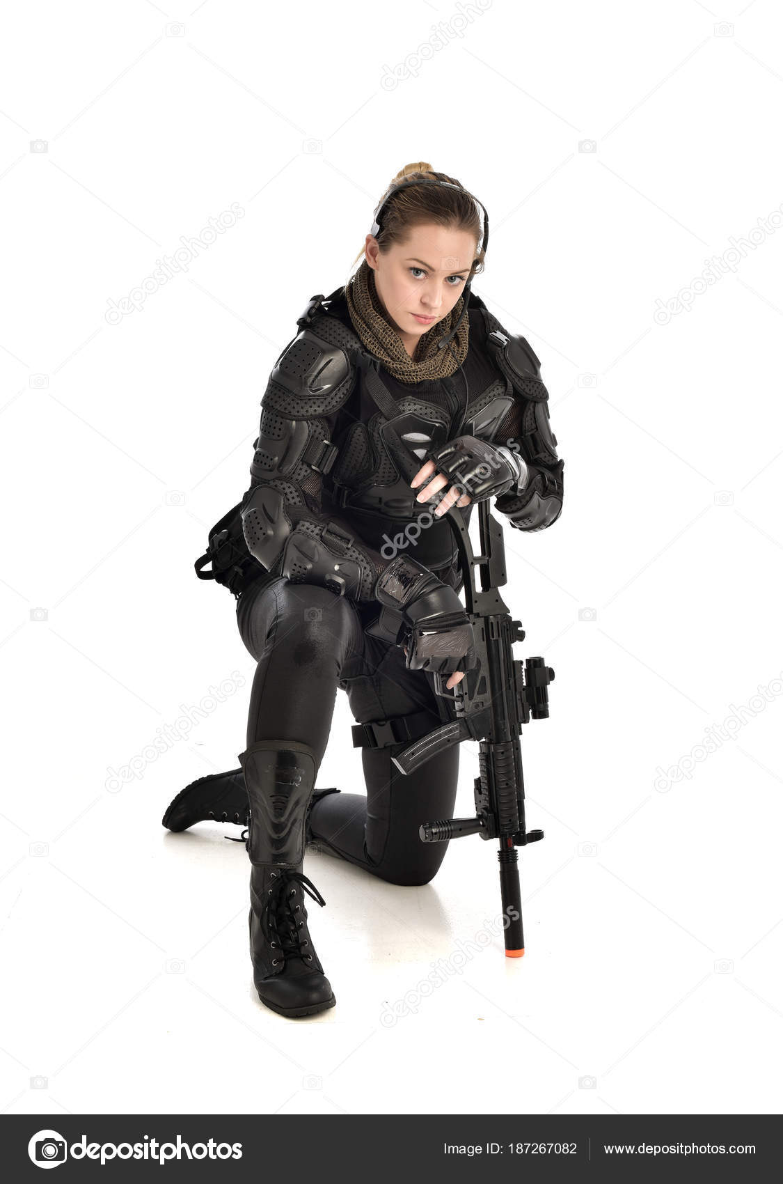 Beautiful powerful woman holding two guns in shooting pose Stock Photo by  ©MerryDesigns 247697548