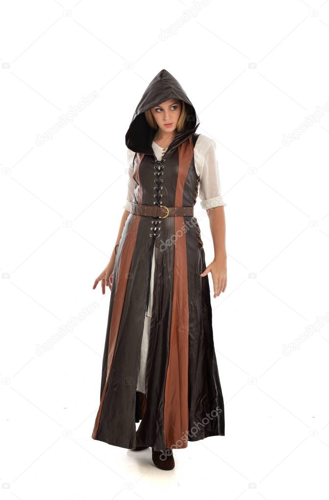 full length portrait of girl wearing brown leather medieval costume, standing pose, isolated on white studio background.