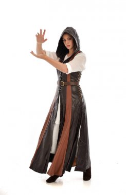 full length portrait of girl wearing brown leather medieval costume, standing pose, isolated on white studio background. clipart