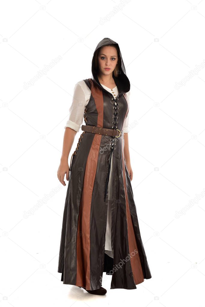 full length portrait of girl wearing brown leather medieval costume, standing pose, isolated on white studio background.
