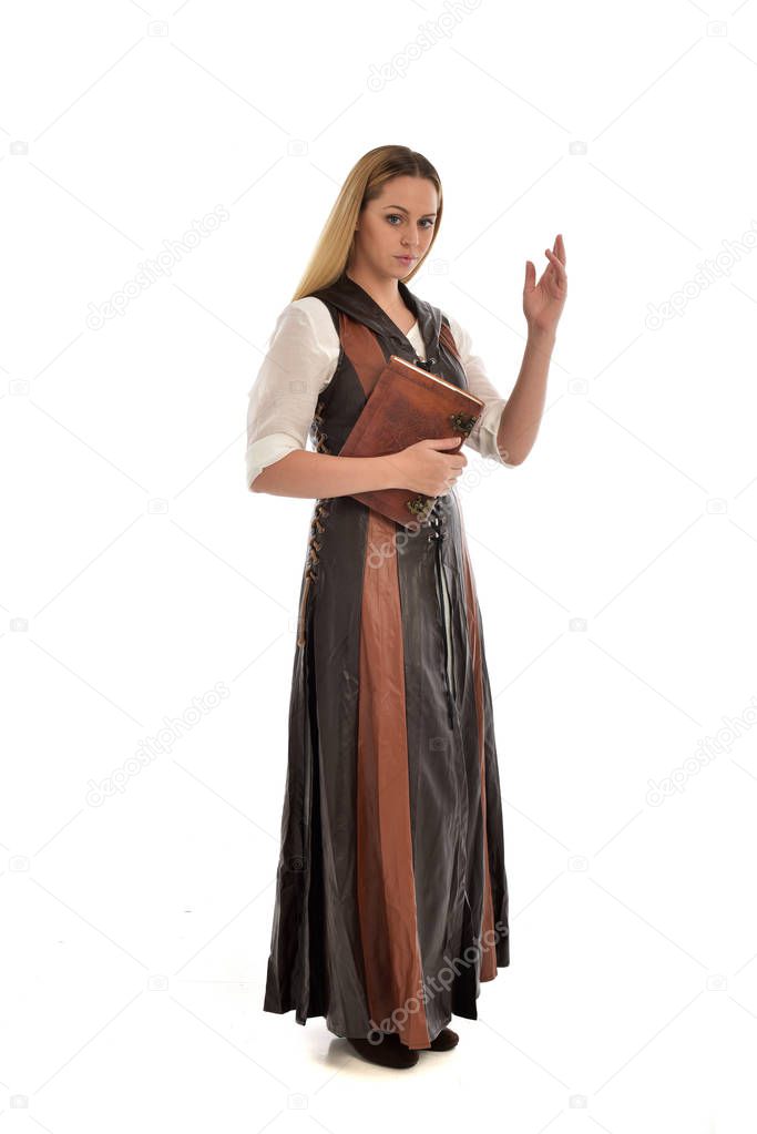 full length portrait of girl wearng brown fantasy outfit, standing pose on white background.
