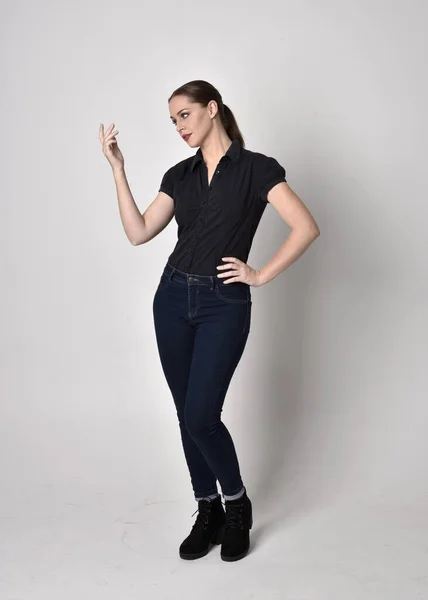 Portrait Pretty Brunette Girl Ponytail Wearing Jeans Boots Black Blouse — Stock Photo, Image