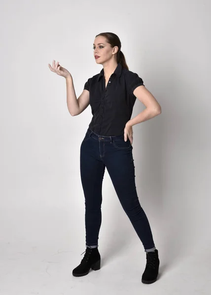 Portrait Pretty Brunette Girl Ponytail Wearing Jeans Boots Black Blouse — Stock Photo, Image
