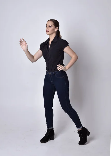 Portrait Pretty Brunette Girl Ponytail Wearing Jeans Boots Black Blouse — Stock Photo, Image