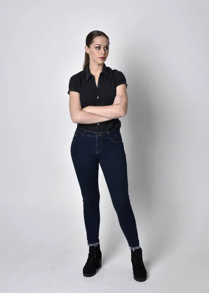 Portrait Pretty Brunette Girl Ponytail Wearing Jeans Boots Black Blouse — Stock Photo, Image