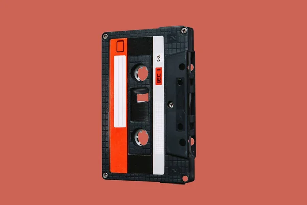 Audio cassette. Vintage audio cassette tap on colored background. Old cassette tape audio isolated on white.