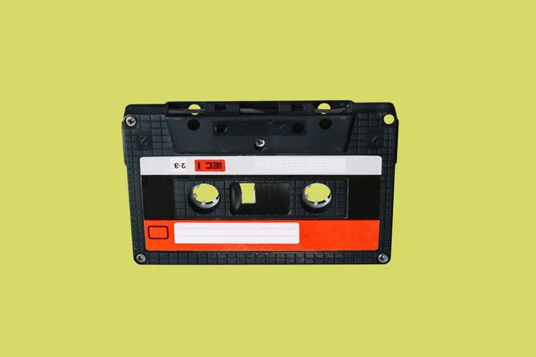 Audio cassette. Vintage audio cassette tap on colored background. Old cassette tape audio isolated on white.
