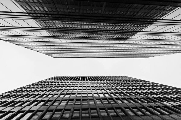Business buildings skyline looking up with sky, high-rise buildings, modern architecture.