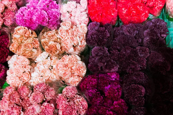 Flower carnation bouquets backgrounds of bright variety of colors, beautiful details in one bouquet. Selective focus