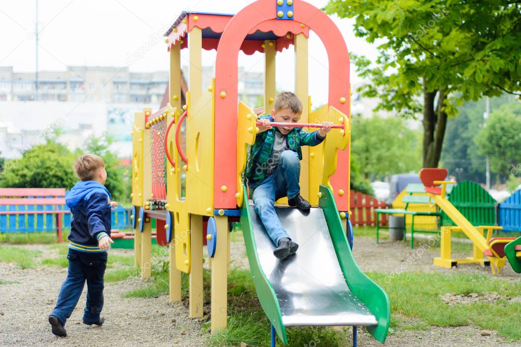 Funny children play on a children's playground