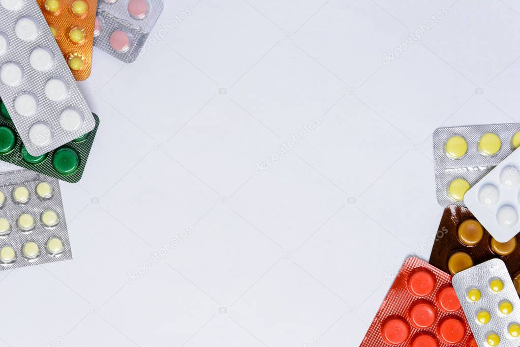 Packages of pills on a white background with a place for the inscription