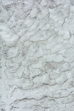 Bitmemiş iş ile sıva kırık eski bir dokulu duvar,