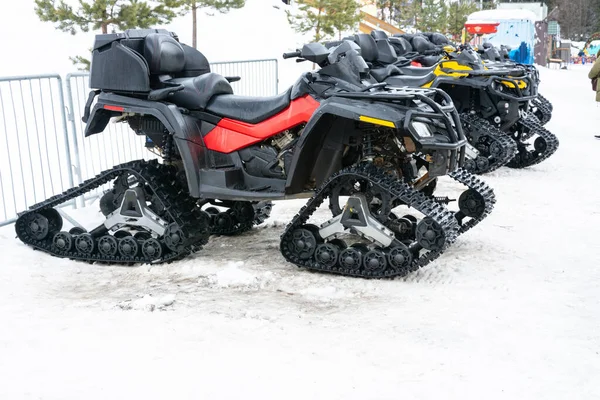 Closeup of snowmobile with snow at ski resort. — Stock Photo, Image