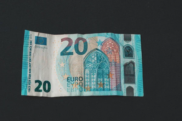 Twenty memorable euros lie on a black background. — Stock Photo, Image