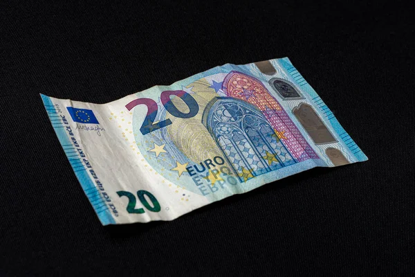 Twenty memorable euros lie on a black background. — Stock Photo, Image