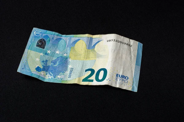 Twenty memorable euros lie on a black background. — Stock Photo, Image