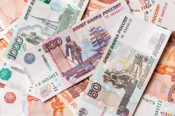The texture of banknotes in denominations of 5000, 1000, 500 and 50 Russian rubles. — Stock Photo, Image