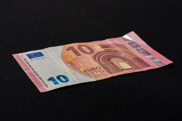 European denomination of ten euros on black background. — ストック写真