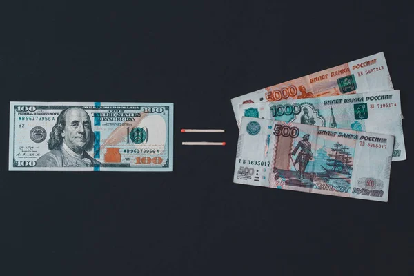 Dollars and Russian rubles on black background — Stok fotoğraf