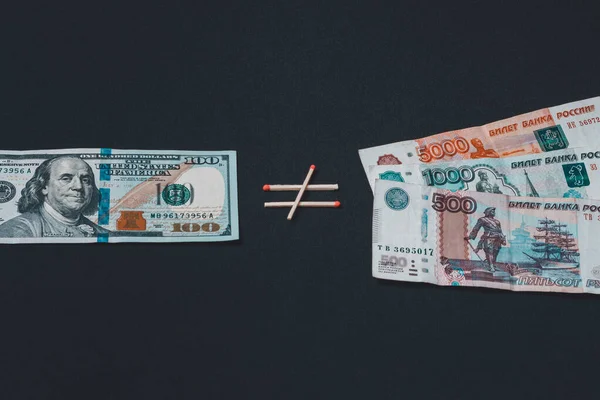 Dollars and Russian rubles on black background — Stok fotoğraf