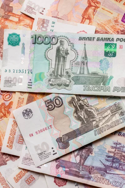 The texture of banknotes in denominations of 5000, 1000, 500 and 50 Russian rubles. — Stock Photo, Image