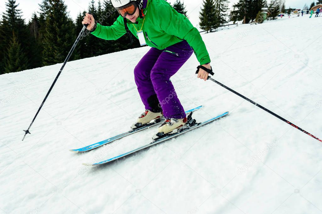 The young guy skis in the Carpathians is not very skillful.