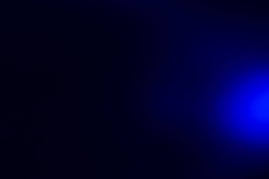 Siyah arkaplanda mavi bokeh yakın plan.