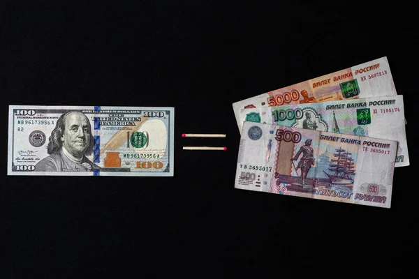 Dollars and Russian rubles on black background — Stok fotoğraf