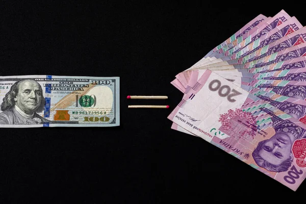 Euro and hryvnia, banknotes on black background. — Stok fotoğraf