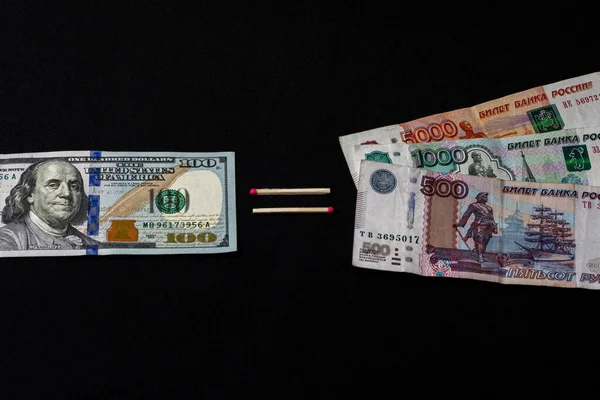 Dollars and Russian rubles on black background — Stok fotoğraf