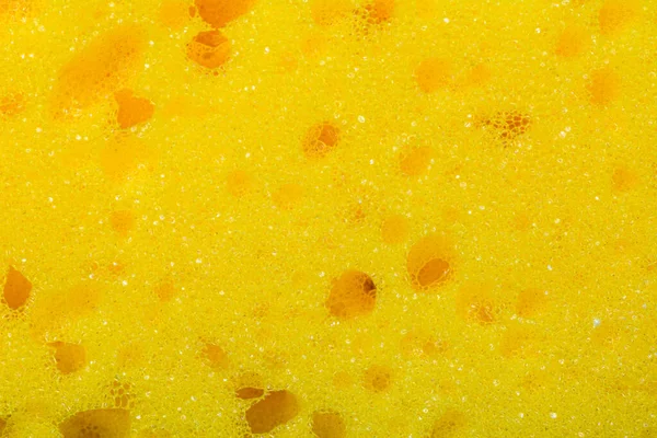 Closeup yellow sponge, close-up photography, yellow texture 2020