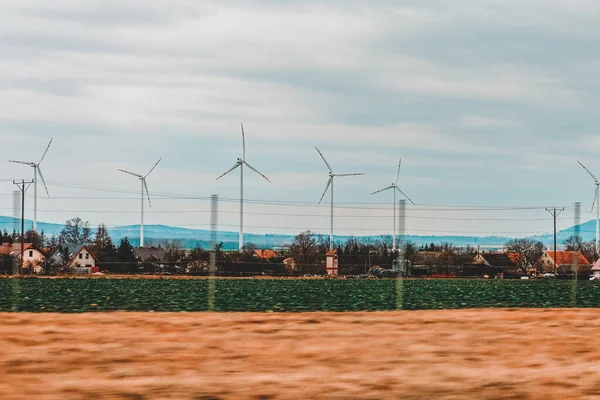 Windmills in mountain fields on the border of Germany and Poland 2020