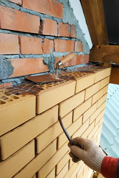 The master lays masonry silicate brick, the walls and facade of the house are made of blocks and bricks.2020