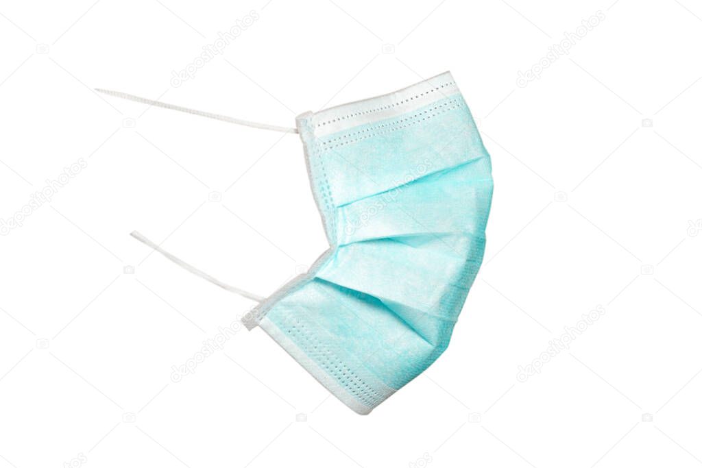 Green medical and surgical mask that protects against pandemic virus isolated on a white background. Side view and face profile 2021