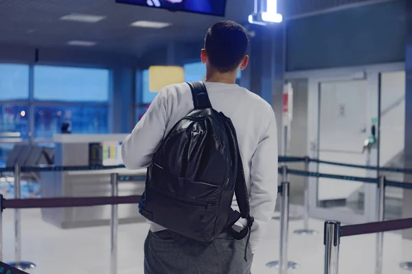 A man at the airport, one is landing, VIP registration. The man was late to the airport. How much do you need to go to the airport. A man with a backpack at the airport.