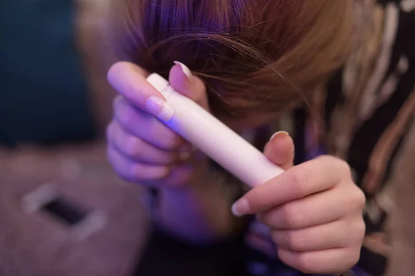 The girl holds in her hands a tube with medicine. Coronavirus. Girl holds medicine.