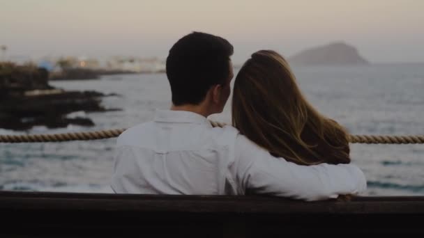 Couple Sits Vacation Bench Background Ocean Mountains Loving Couple Hugs — Stock Video