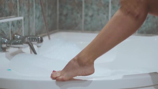 Girl Smears Feet Cream Bath — Stock Video