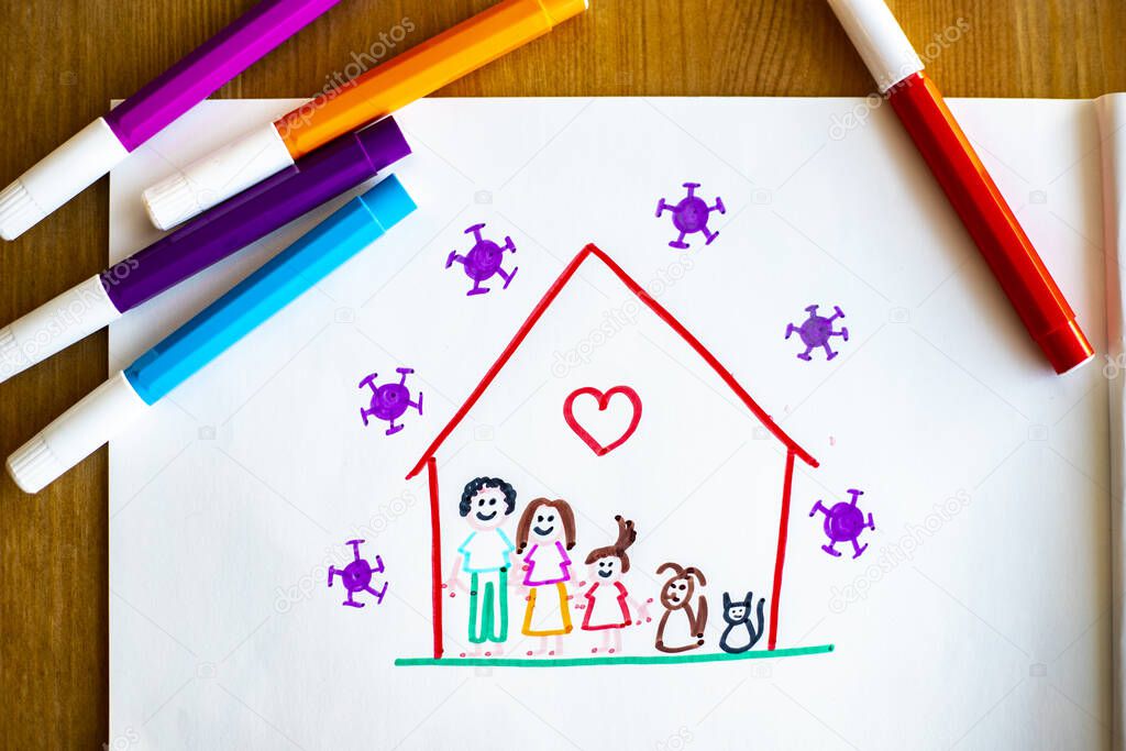 Little child's drawing, on wooden background with color pens around, representing she and her family and pets happy at home during covid-19 lockdown for coronavirus pandemic, with viruses outside of their house.